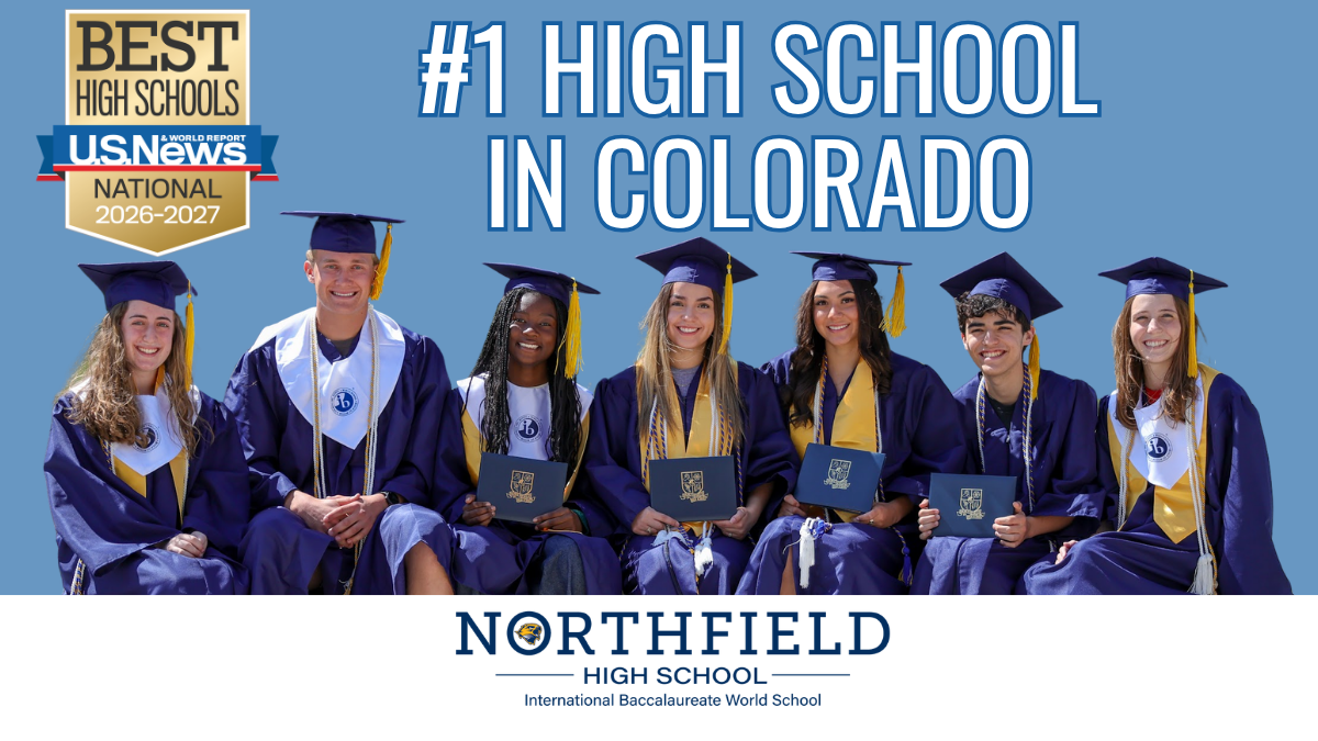7 students with cap/gown/diplomas.