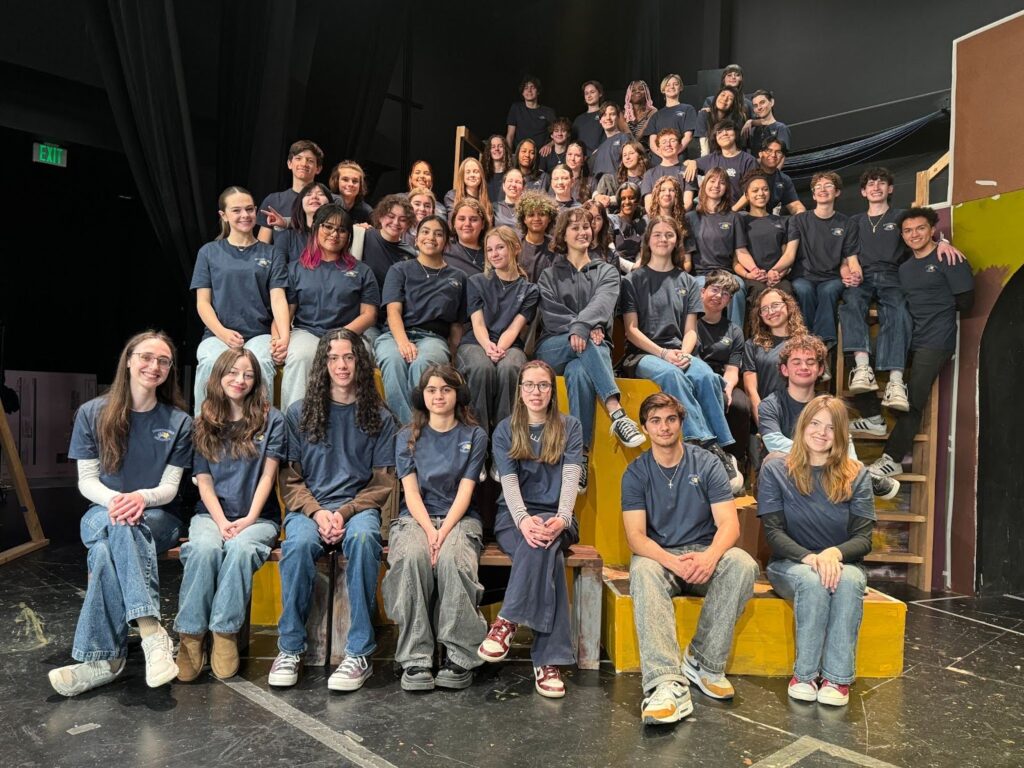 Group photo of theater students on the set.